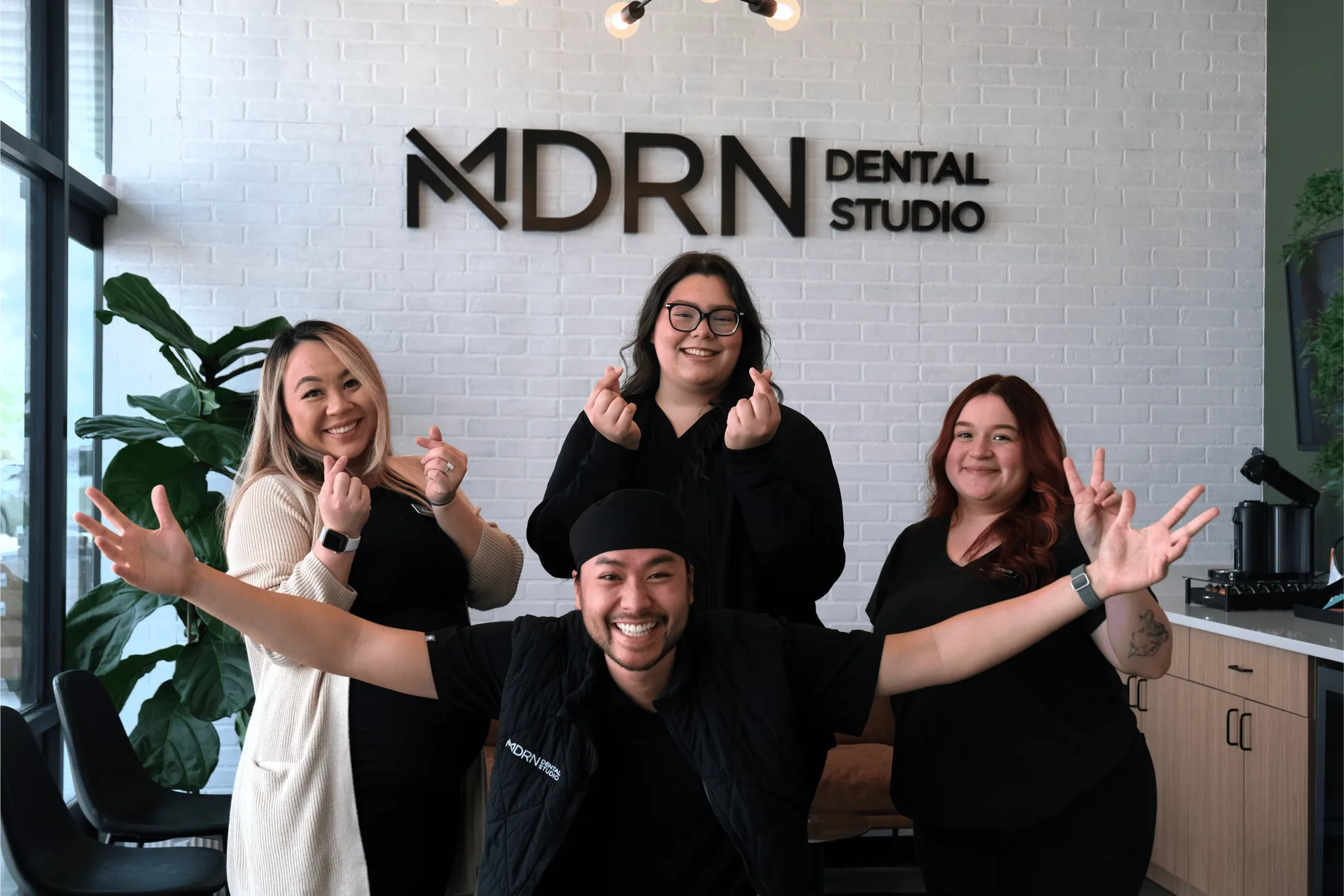 MDRN Dental Studio team smiling in the McKinney dental office